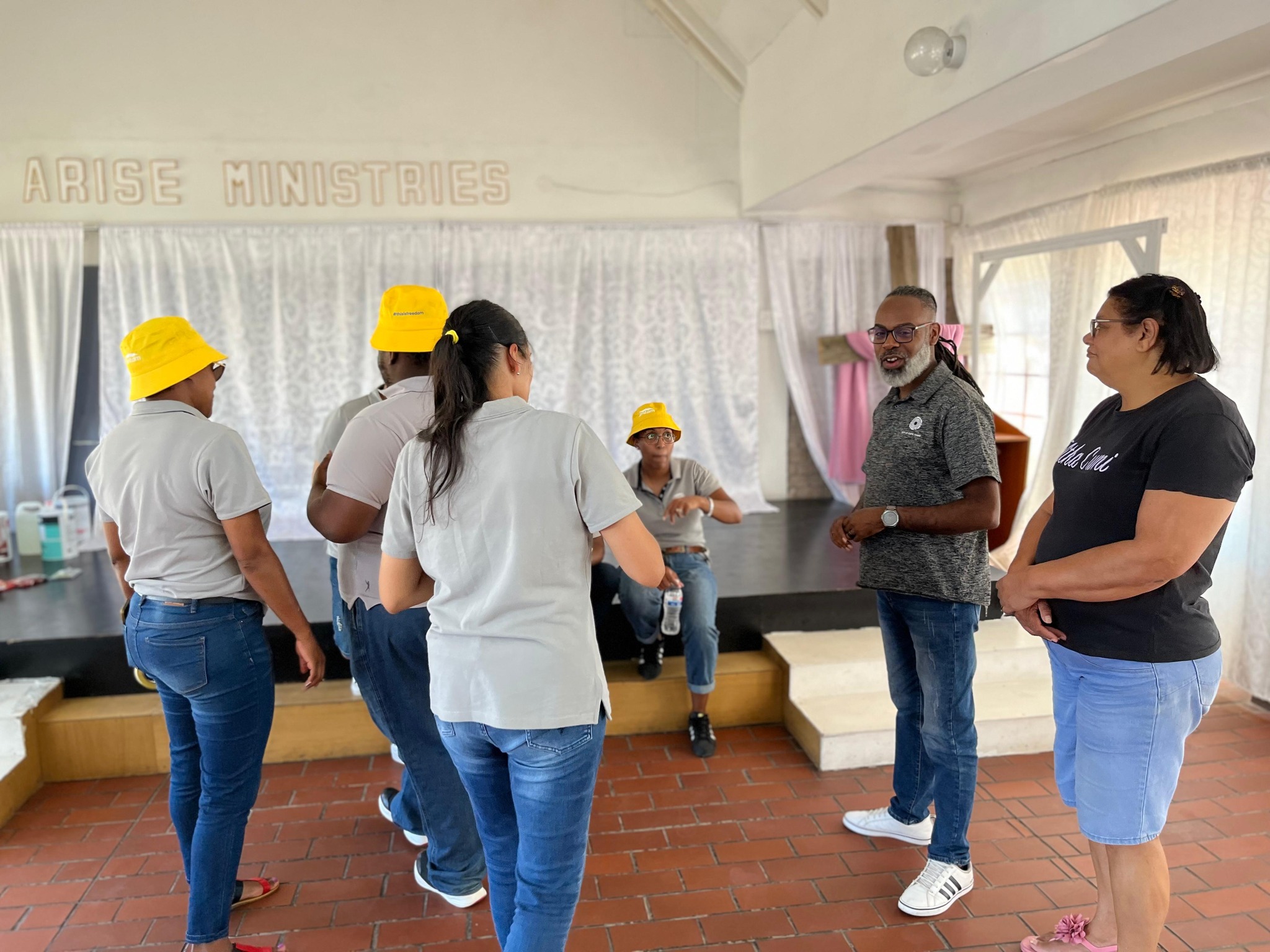 Volunteers painting and cleaning